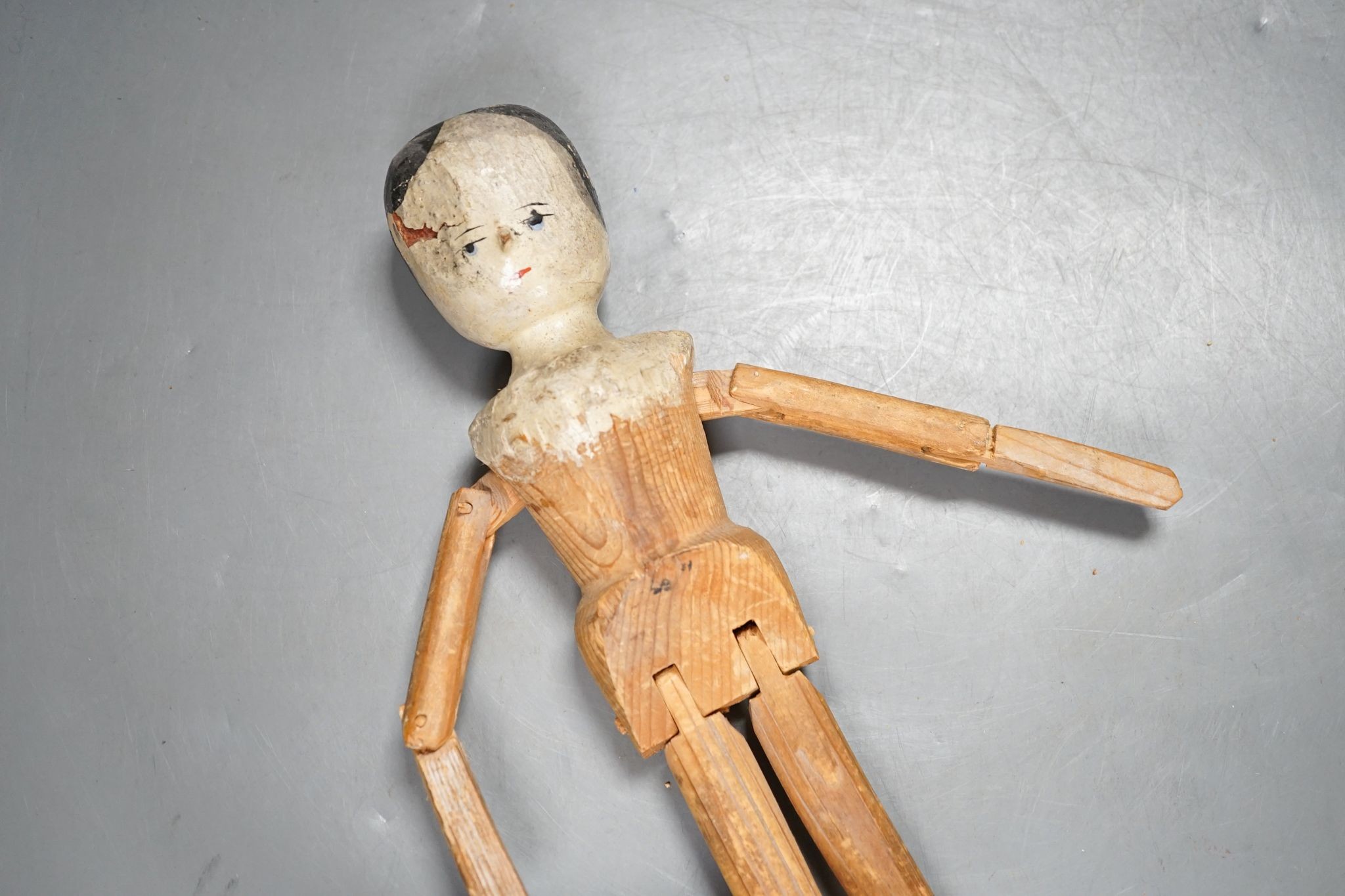 A 19th German carved wood peg doll 32cm